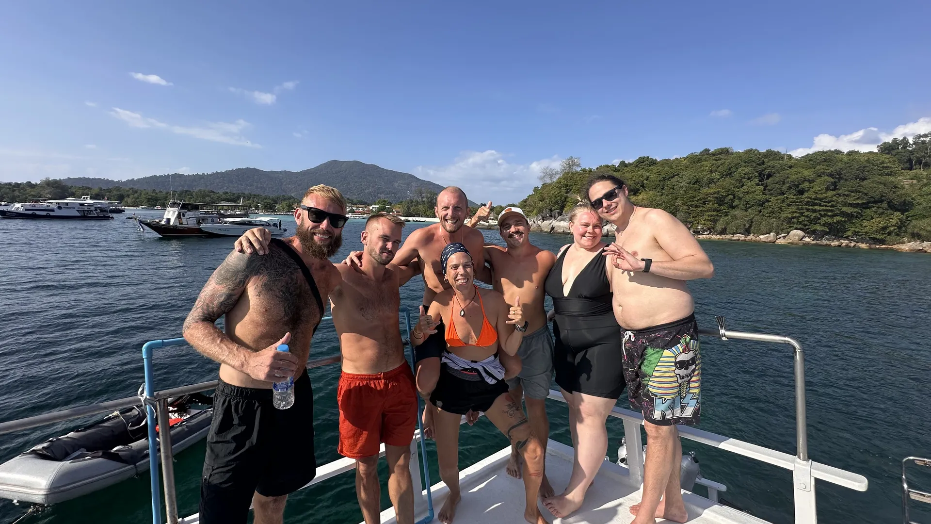 A first-time diver with an instructor close behind in the clear water of Koh Lipe
