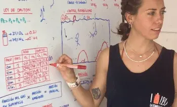 Instructor refreshing dive theory on the whiteboard