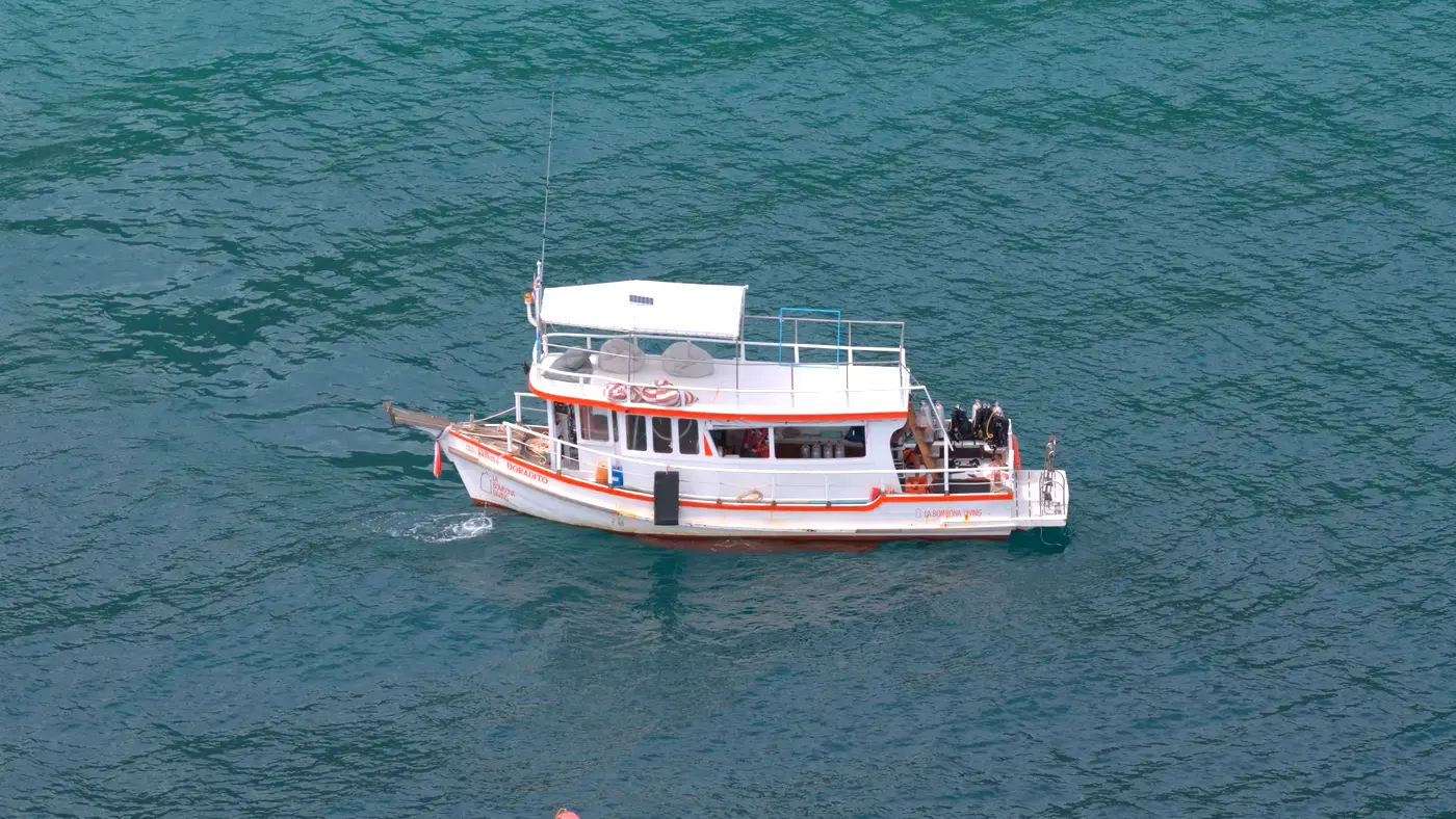 The La Bombona Diving dive boat anchored over the reef in Koh Lipe