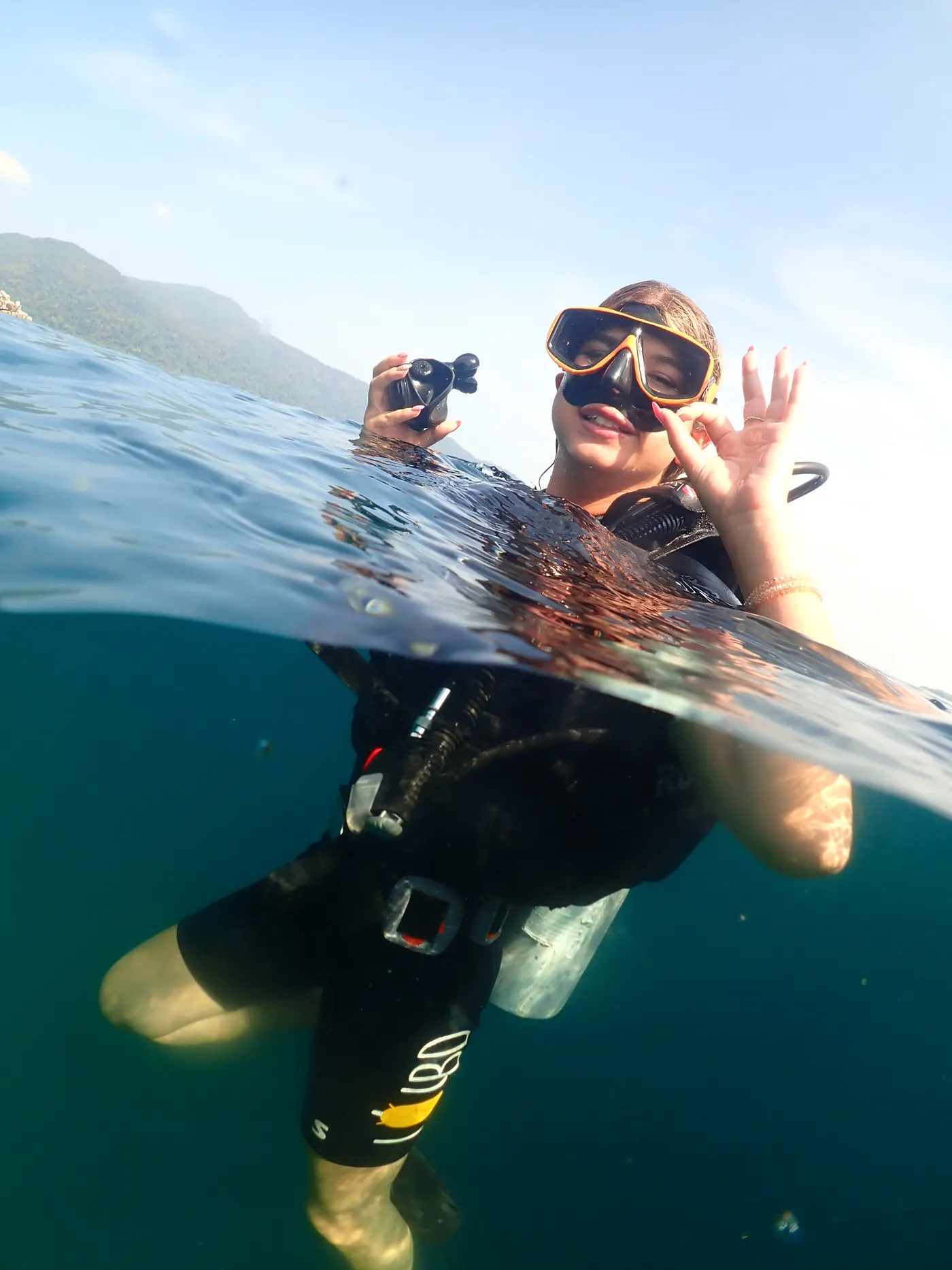 Two divers at the surface in Koh Lipe giving the OK sign