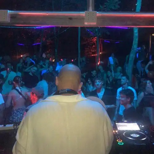 Escobar jungle party on Koh Tao — DJ stage lit up among the trees at night