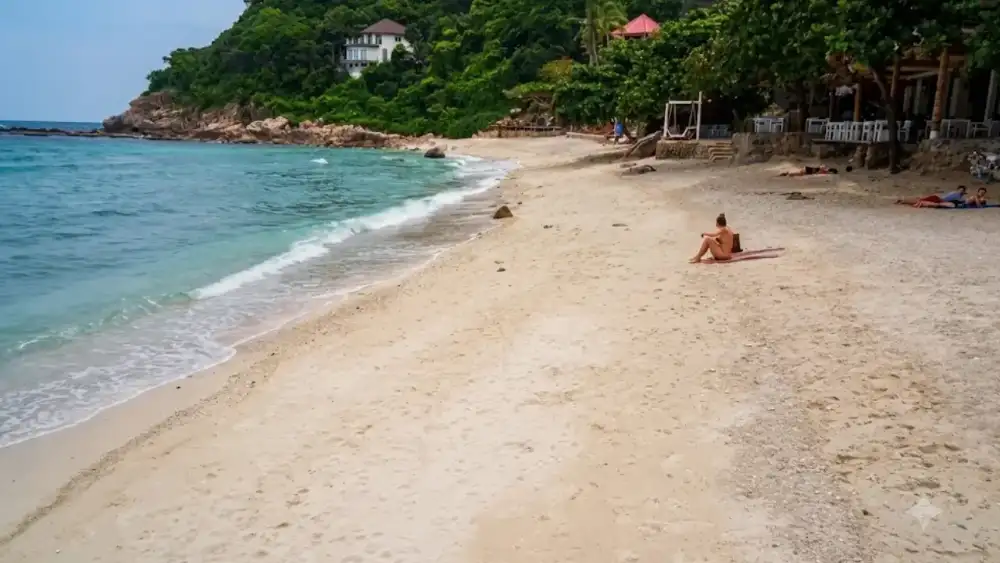 Sai Daeng Beach on Koh Tao's south coast, a quiet sandy beach looking out toward Shark Island