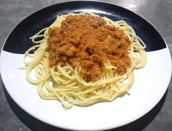 A plate of spaghetti topped with a rich meat ragù at Gambero Rosso Andrea