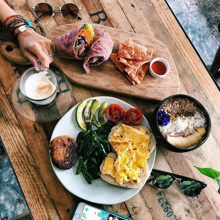 A plate of vegan food and a coffee at The Factory Cafe, Koh Tao